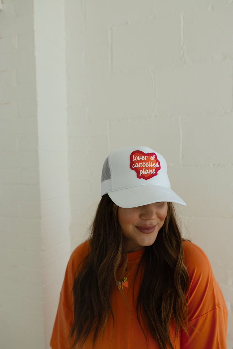 LOVER OF CANCELLED PLANS TRUCKER HAT