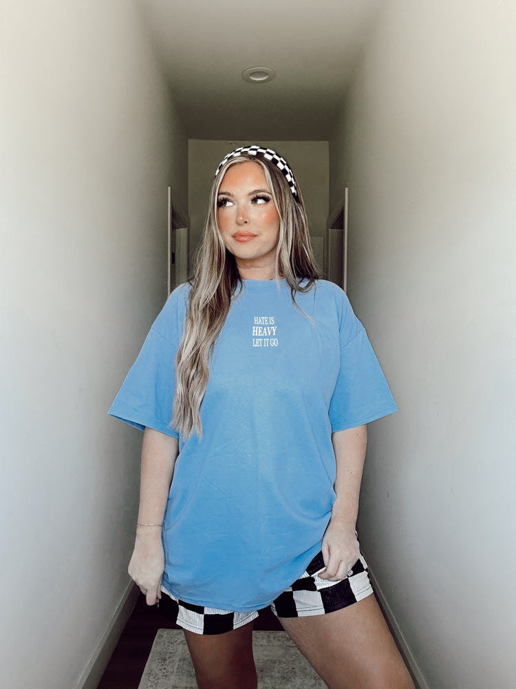 HATE IS HEAVY, LET IT GO (CAROLINA BLUE TEE)