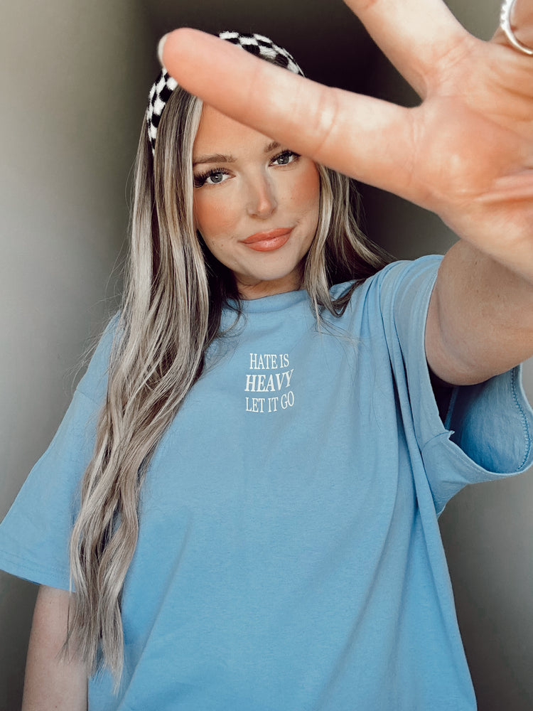 HATE IS HEAVY, LET IT GO (CAROLINA BLUE TEE)